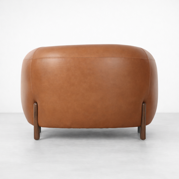 tan leather armchair back view rounded barrel shape