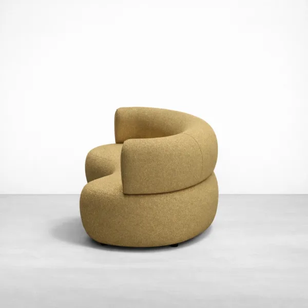 Side view of INTERIORZE Amaira curved beige 3 seater sofa with rounded back and base