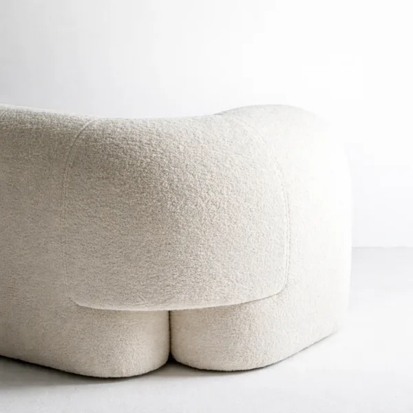 Ivory boucle sofa rear side view showing curved back INTERIORZE Cloudline