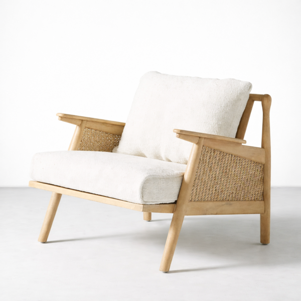 Front view of INTERIORZE ash wood cane lounge chair with plush cream seat and back cushion