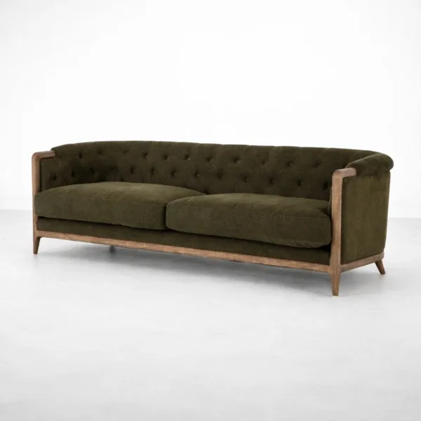 Olive tufted sofa angled view showing teakwood frame and seat cushions by INTERIORZE