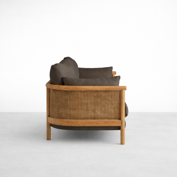 Side view of cane arm 3 seater sofa with cane panel and wooden arm