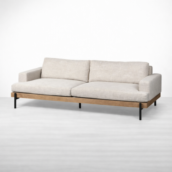 Angled view teakwood base linen sofa with metal legs beige by Interiorze