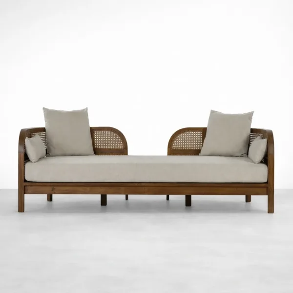 Teakwood rattan daybed sofa with cane sides and beige fabric upholstery by INTERIORZE