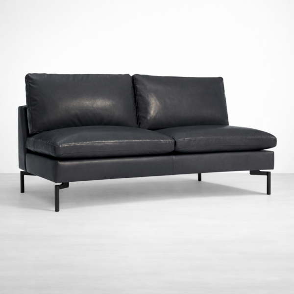 Modern black leather sofa with metal legs and deep seat cushions by INTERIORZE