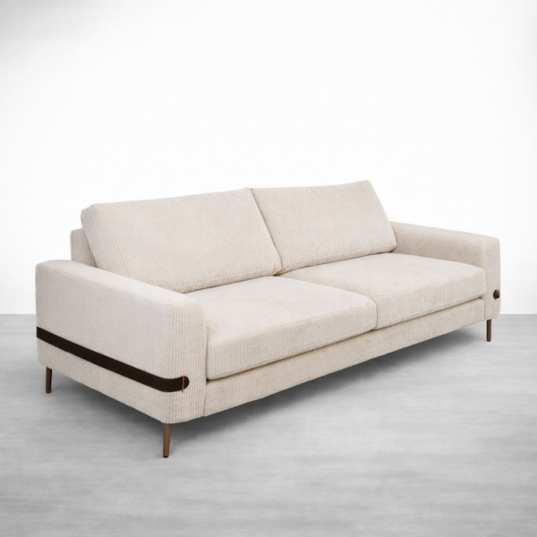 Ivory corduroy 3 seater sofa with leather strap arm detail by INTERIORZE