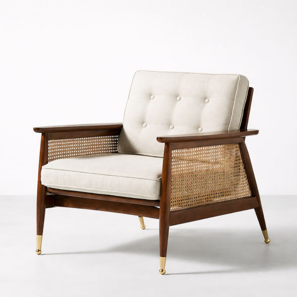 Teakwood cane chair with cream upholstery and gold leg caps