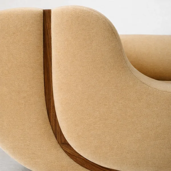 Close up of teakwood accent detail on mustard lounge sofa by INTERIORZE