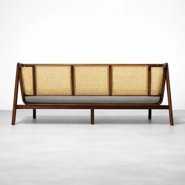 Back view of teakwood rattan sofa with cane panels and dark teak polish by INTERIORZE