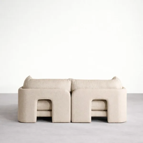 Back view of teakwood beige modular sofa with clean upholstered finis