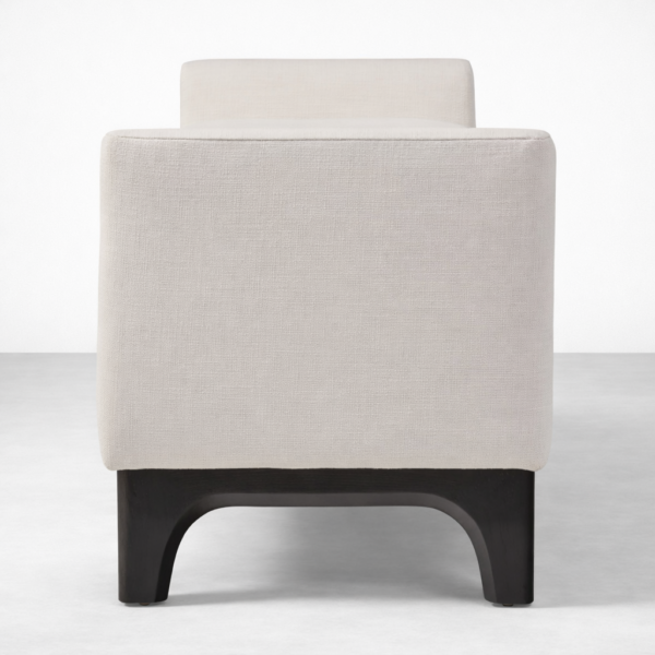 Side angle view of Noircrest upholstered teakwood bench with black wash polished base