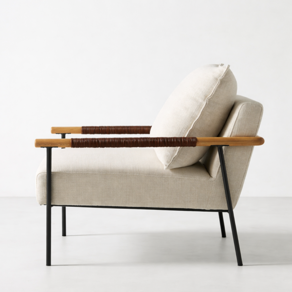 Teakwood lounge chair with beige upholstery and metal frame side view