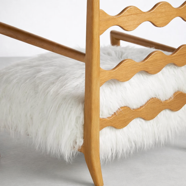 Close-up of ash wood wave ladder back and white faux fur seat on lounge chair