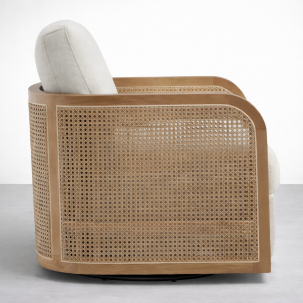 Side view of INTERIORZE Arlo rattan accent chair in ivory upholstery with rattan side panel