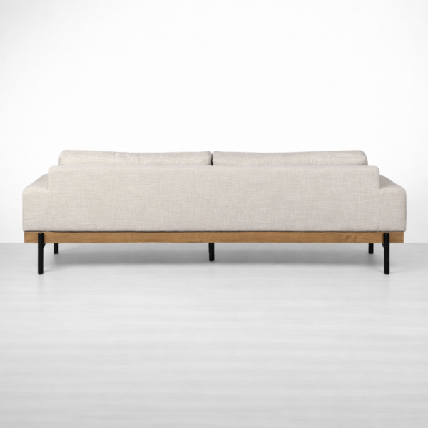 Back view of teakwood base linen sofa with metal legs by Interiorze