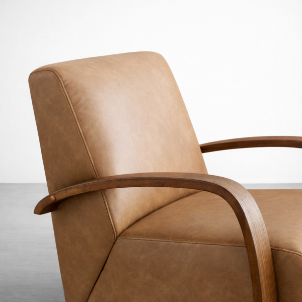 tan leather swivel armchair teakwood arm detail close up