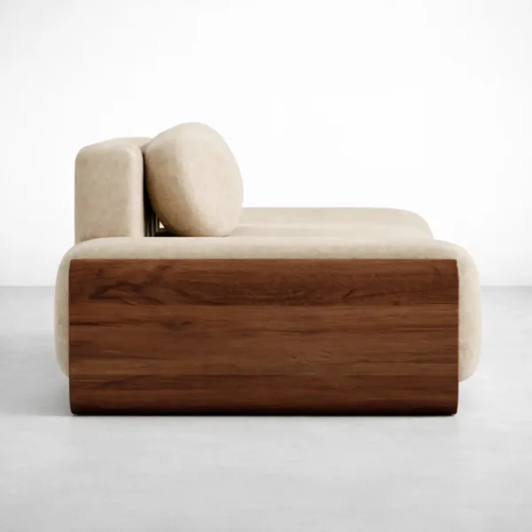 Side view of ivory lounge sofa showing teakwood block arm and round cushion by INTERIORZE