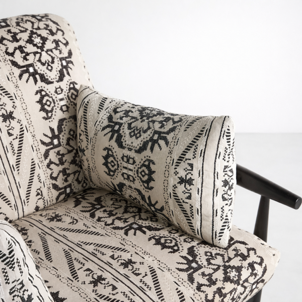 Tribal print fabric upholstery on teakwood accent chair