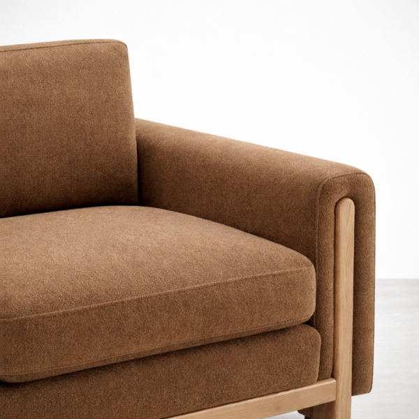 ash wood upholstered armchair arm detail with walnut brown fabric