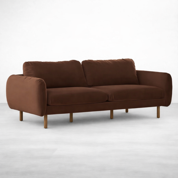 Angled view of brown velvet 3 seater sofa with teakwood legs by INTERIORZE