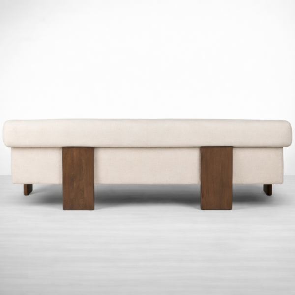 Back view of cream teakwood sofa showing wooden frame and warm polish by INTERIORZE