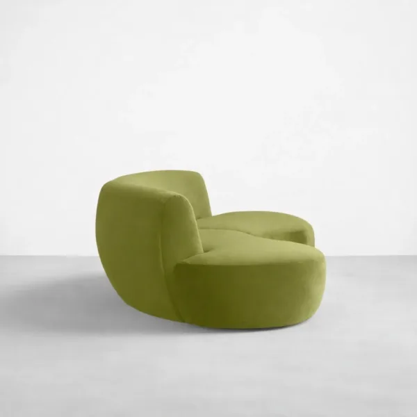 Side view of INTERIORZE Nysa olive green curved 3 seater sofa with rounded back and low base