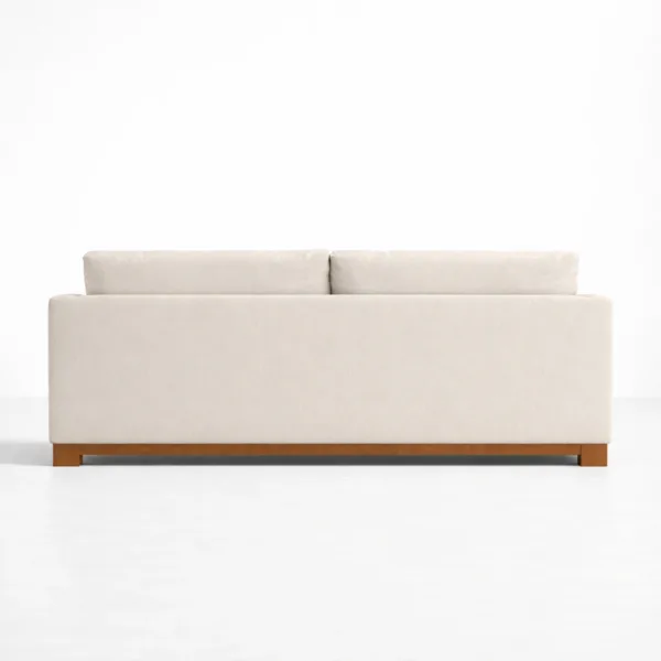 Back view of ivory fabric sofa showing teakwood base by INTERIORZE