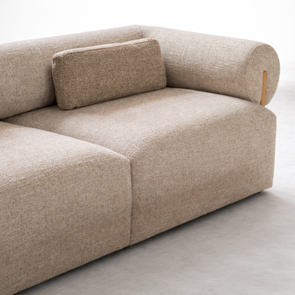 Close-up of beige fabric upholstery and cushion comfort on INTERIORZE sofa