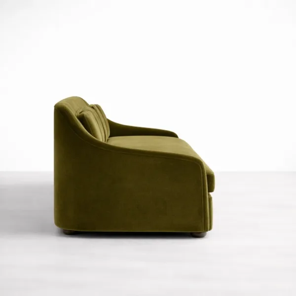 Side view olive green velvet sofa with curved arm design INTERIORZE Aurelia