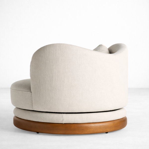 beige swivel lounge chair with round teakwood base