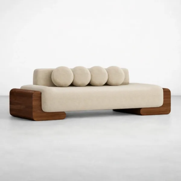 Ivory lounge sofa with teakwood block arms and round cushions by INTERIORZE front angled view