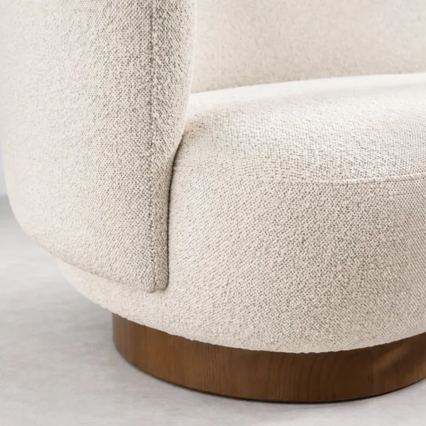 Ivory boucle sofa fabric texture with walnut teakwood plinth base detail