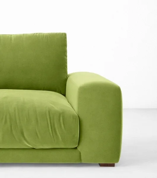Lime green lounge chair close-up showing wide arm and deep cushion, INTERIORZE LIMEA.