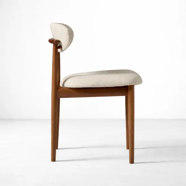 Ivory bouclé teak dining chair side profile showing curved back