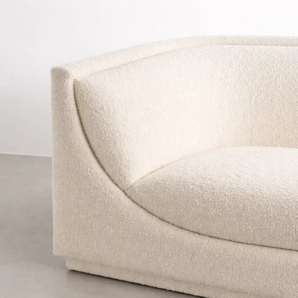 Close-up of INTERIORZE Arcline ivory boucle 2 seater sofa showing sculpted curved back and contoured seat