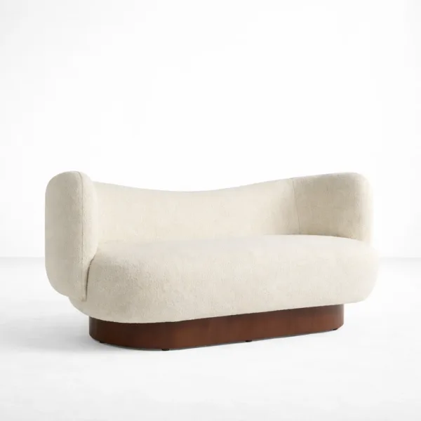 Ivory boucle 2 seater sofa angled view showing wraparound arms and walnut teakwood base