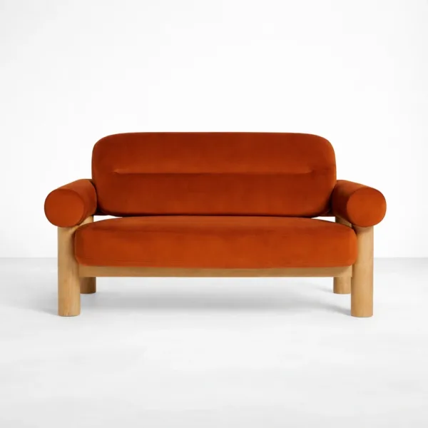 Rust orange 2 seater sofa front view with low back cushion and teakwood legs by INTERIORZE Terra