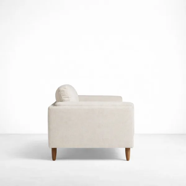 Beige 2 seater sofa side view with box arms and teakwood base