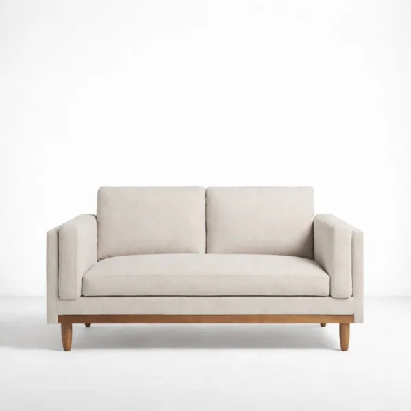 Beige 2 seater sofa with teak base front view by INTERIORZE Haven