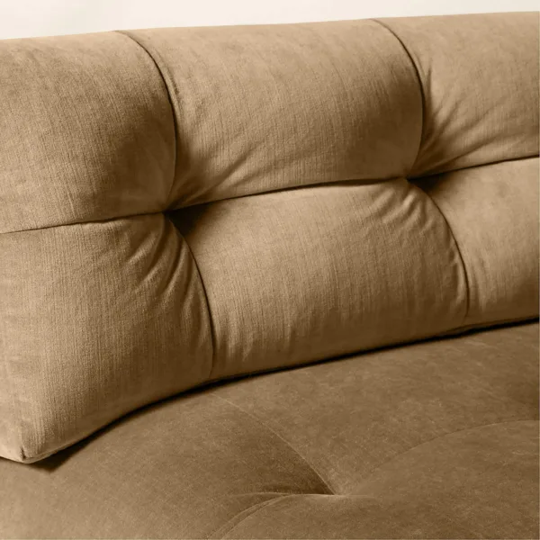 Close-up tufting detail of camel beige velvet upholstery on INTERIORZE sectional sofa