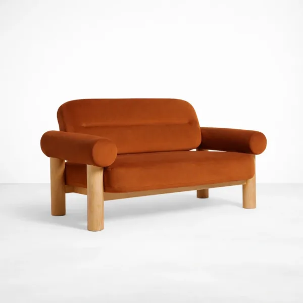Rust orange 2 seater sofa angled front view with rounded arms and teakwood frame by INTERIORZE
