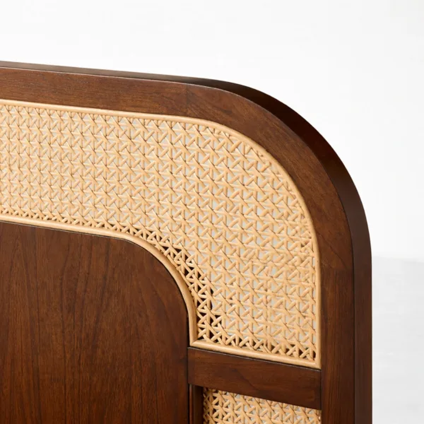 Close-up of woven cane panel and curved teakwood frame on INTERIORZE Arinya bed