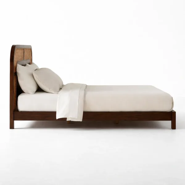 Side view of INTERIORZE Arinya teakwood cane headboard bed with woven cane panel headboard