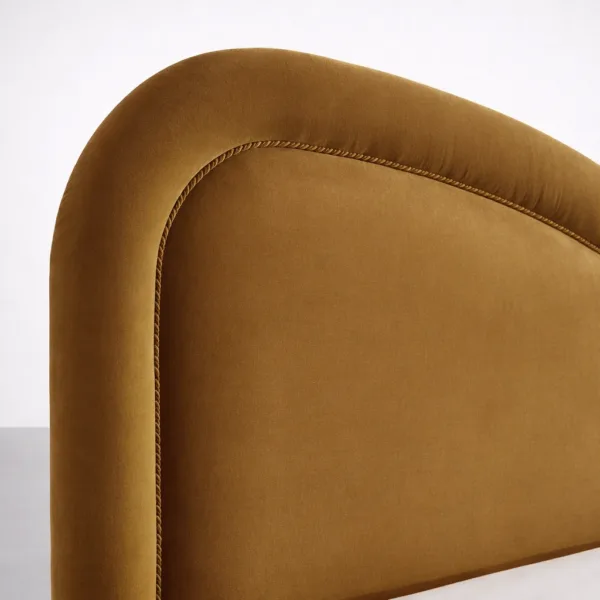 Heartback headboard detail on mustard velvet upholstered bed INTERIORZE Aurelia