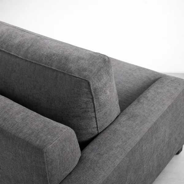 Charcoal grey sectional sofa fabric detail and clean stitching by INTERIORZE