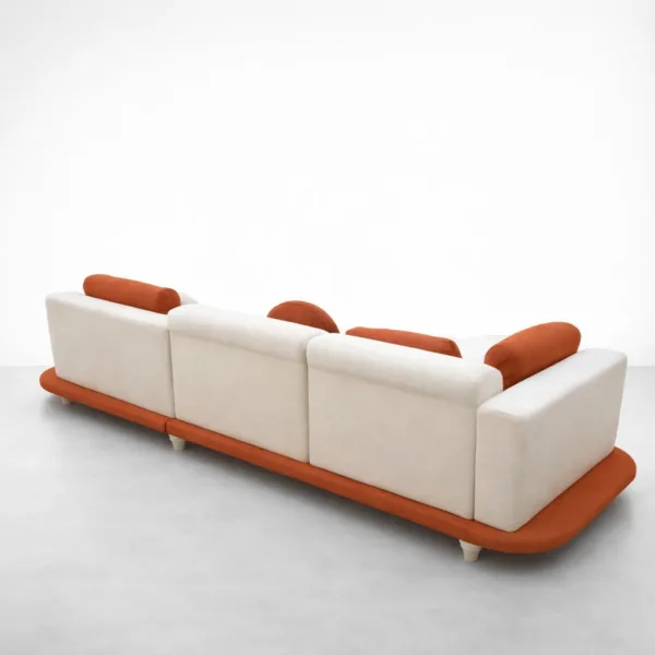 Belmond curved chaise sectional sofa in off-white with rust orange base, back view