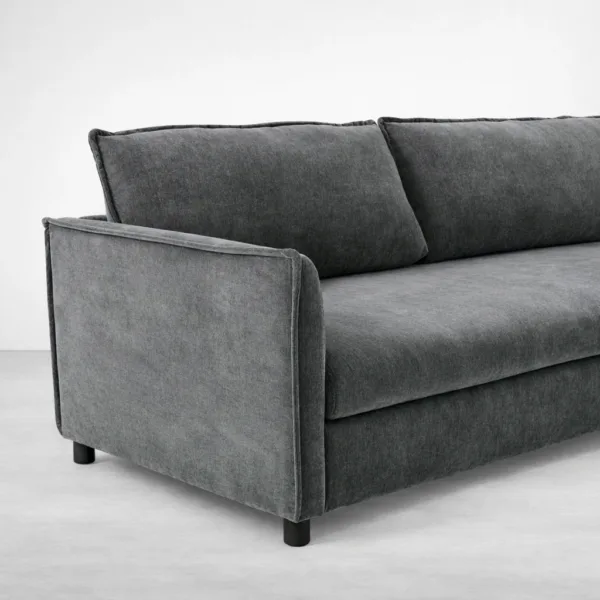 Close-up of grey upholstery fabric texture and square armrest on sofa cum bed INTERIORZE