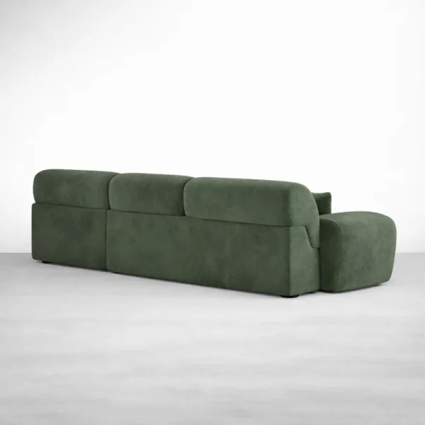 Back angle view of green modular chaise sofa with rounded arms