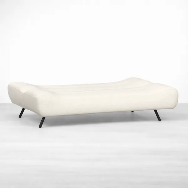 Cream bouclé sofa cum bed opened into a sleeping surface