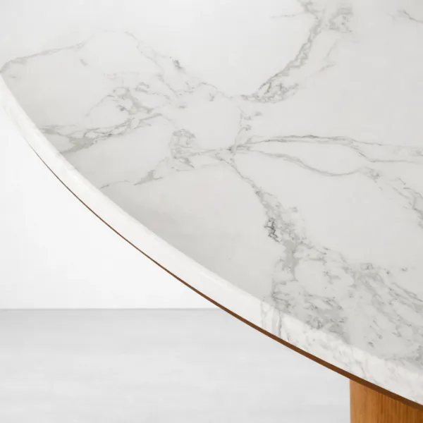 White marble top with grey veining on Aurelia round marble top teakwood dining table